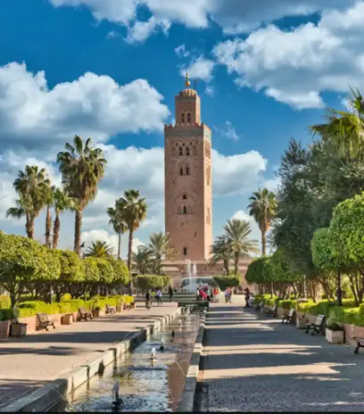2 days tour from Marrakech to Zagora 5 Koutoubia Mosque rises above lush Marrakesh gardens, highlighting iconic city heritage and memorable cultural experiences offered by Morocco Trip Way.