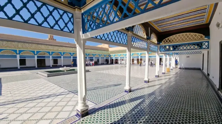 Central courtyard of Bahia Palace features ornate arches, tiled floors, tranquil fountains, and lush gardens on a Marrakech Itinerary 4 Days.
