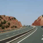 Morocco highway through red rocky landscape